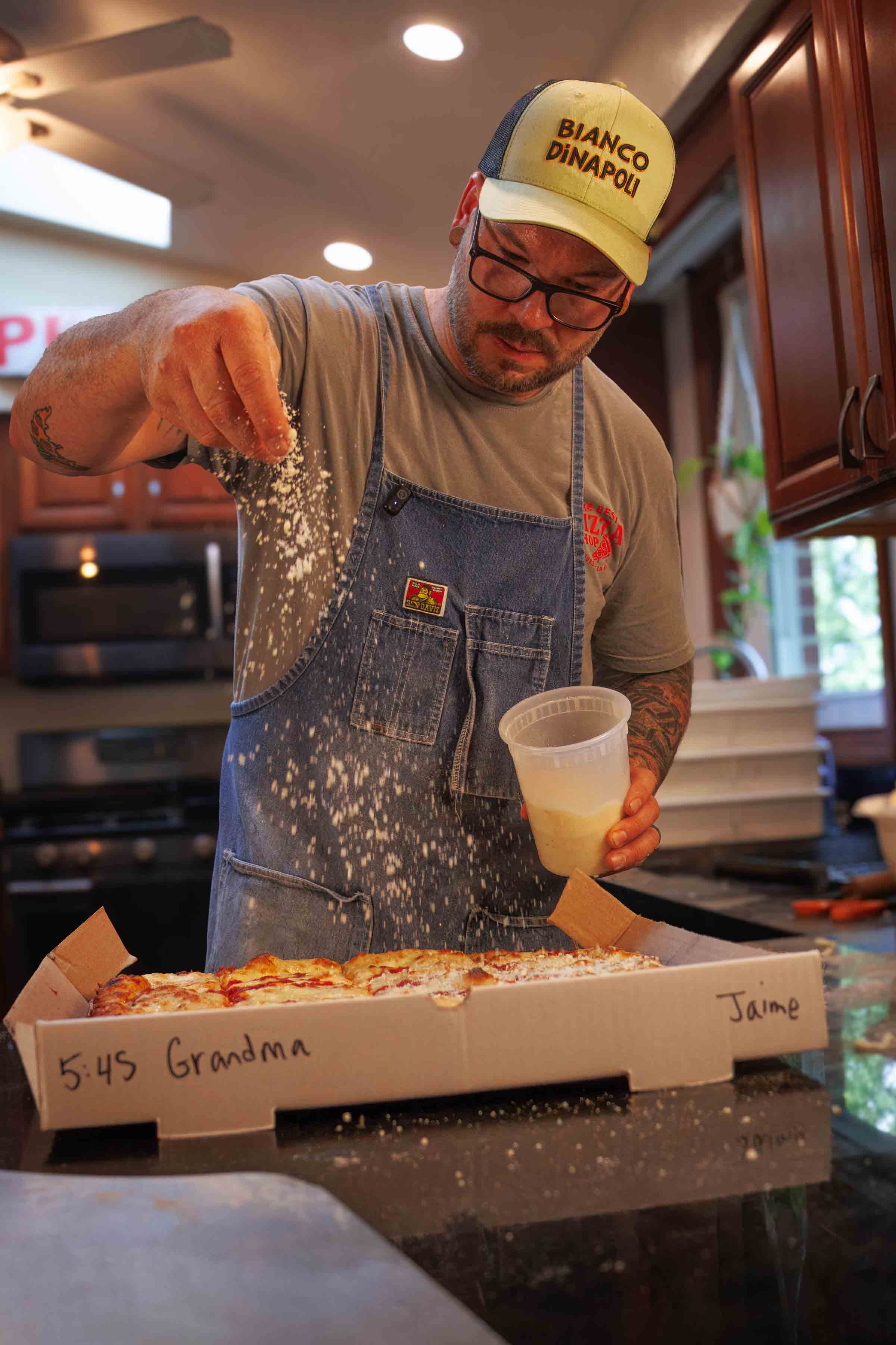 Jesse Wisinski stretching pizza dough in Beaver County, Pennsylvania
