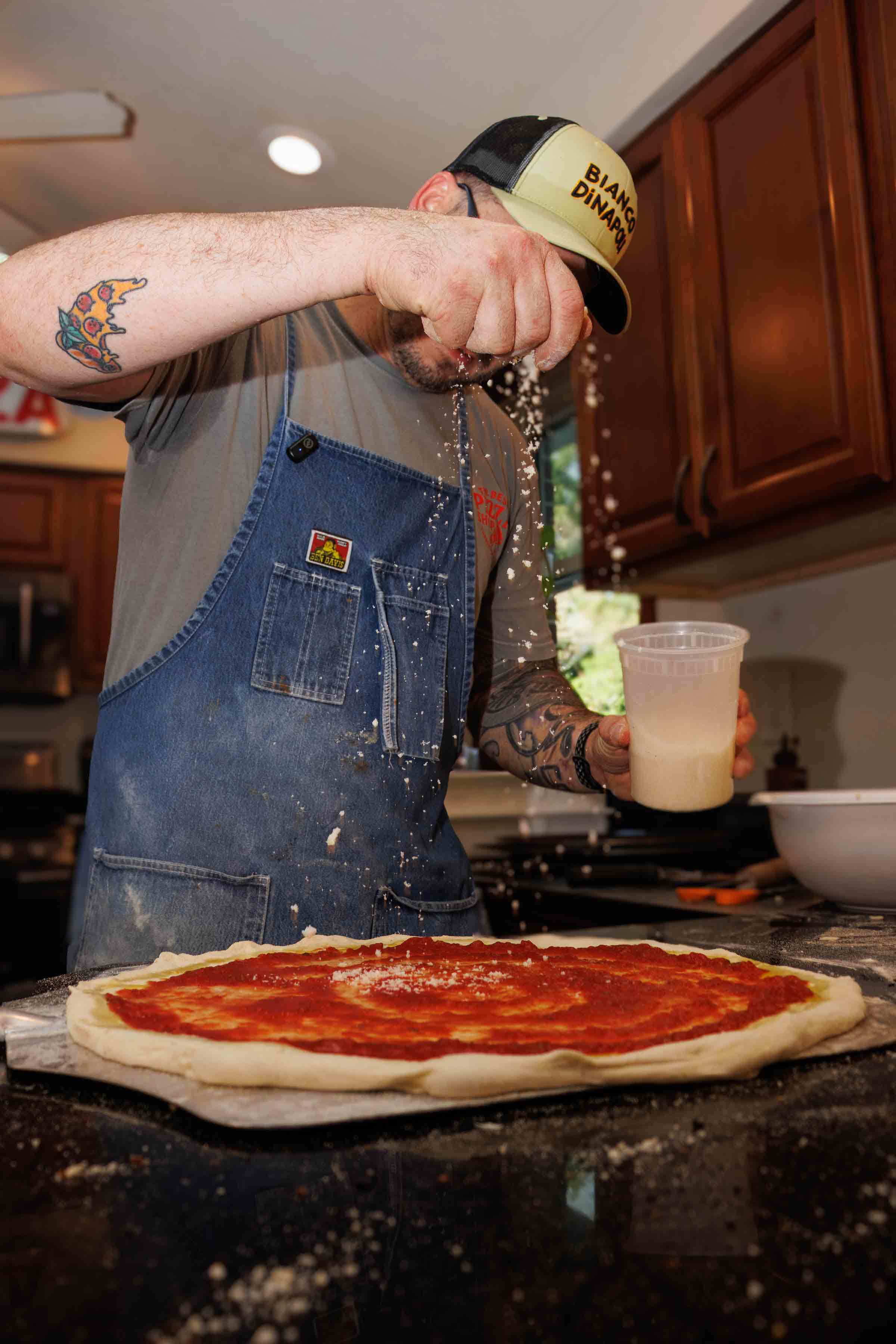 Jesse Wisinski stretching pizza dough in Beaver County, Pennsylvania
